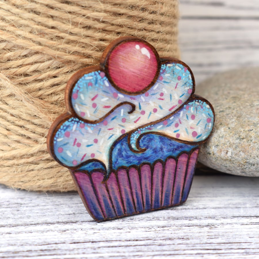 Blue Raspberry cupcake brooch hand burned using pyrography.