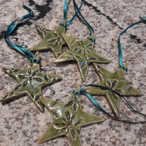 Green handmade ceramic star hanging decoration 