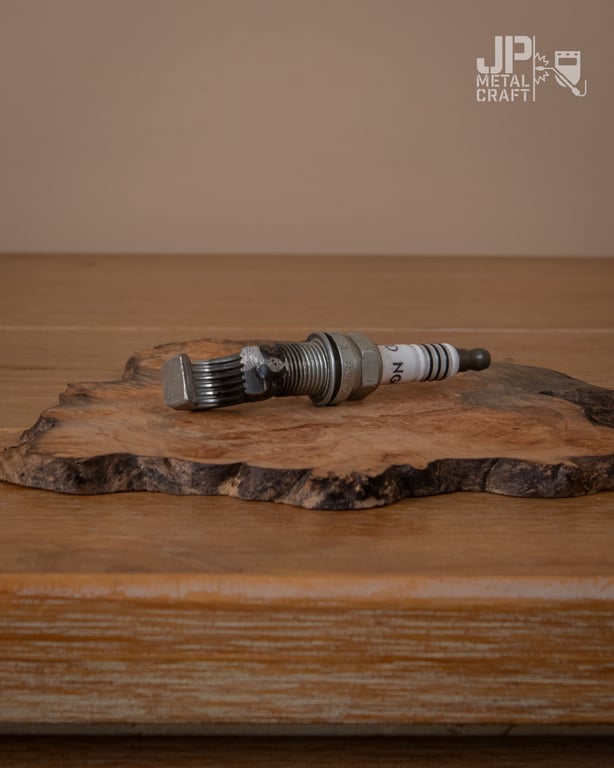 Spark plug bottle opener 