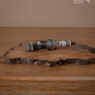 Spark plug bottle opener 