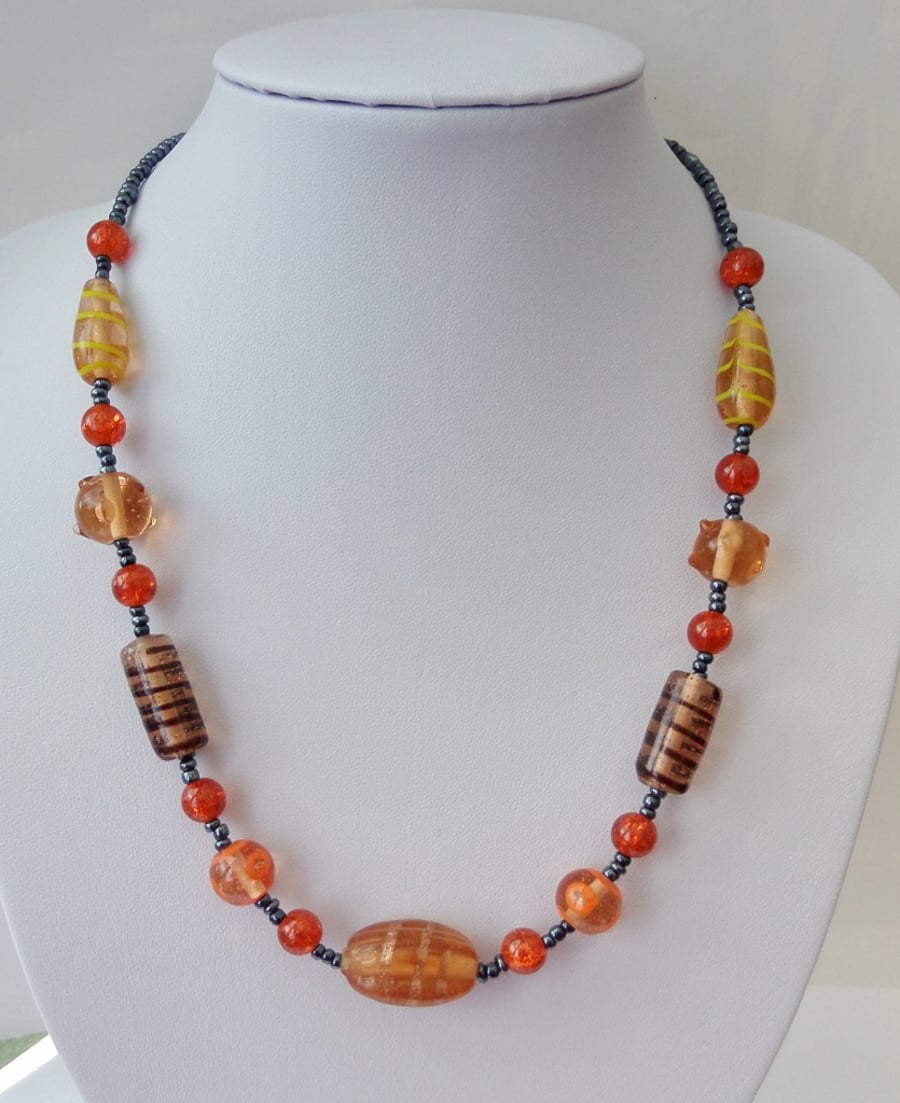 Mixed lamp work and orange crackle  glass bead necklace. Gift or treat