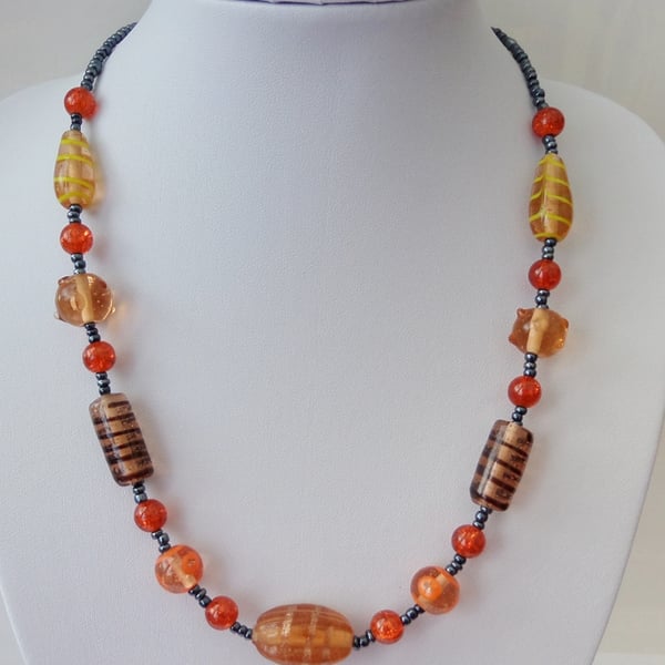 Mixed lamp work and orange crackle  glass bead necklace. Gift or treat