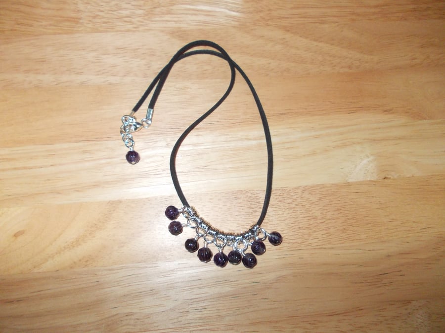 Carved amethyst charm necklace