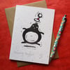 Bouncing Penguin - lino cut print Christmas card