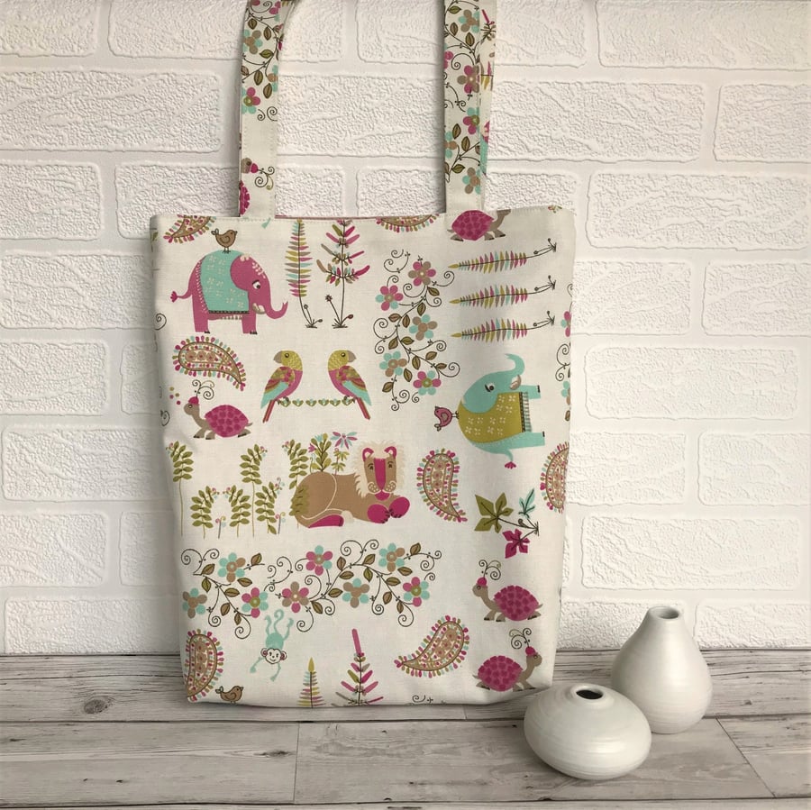 Tropical animals tote bag in cream with brightly coloured animals and flowers