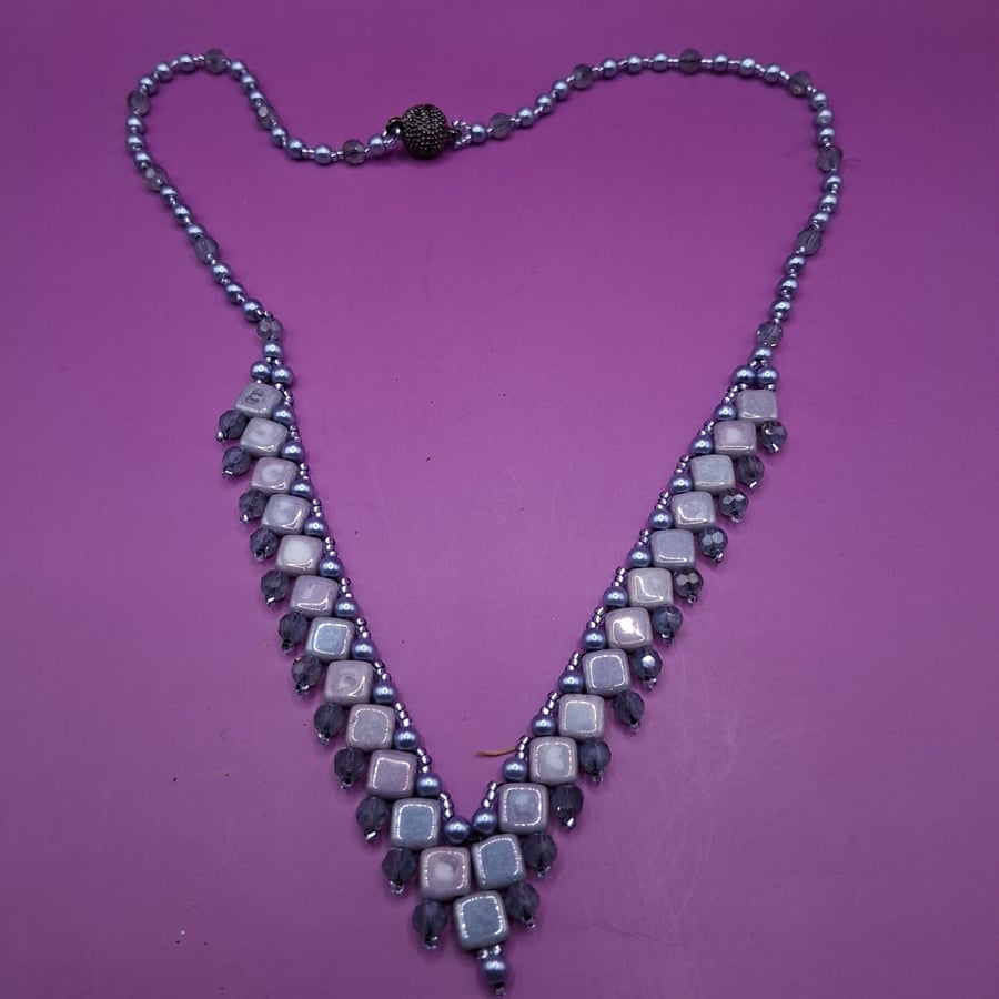Handmade Beaded Dip front necklace in Silver