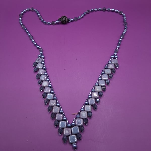Handmade Beaded Dip front necklace in Silver