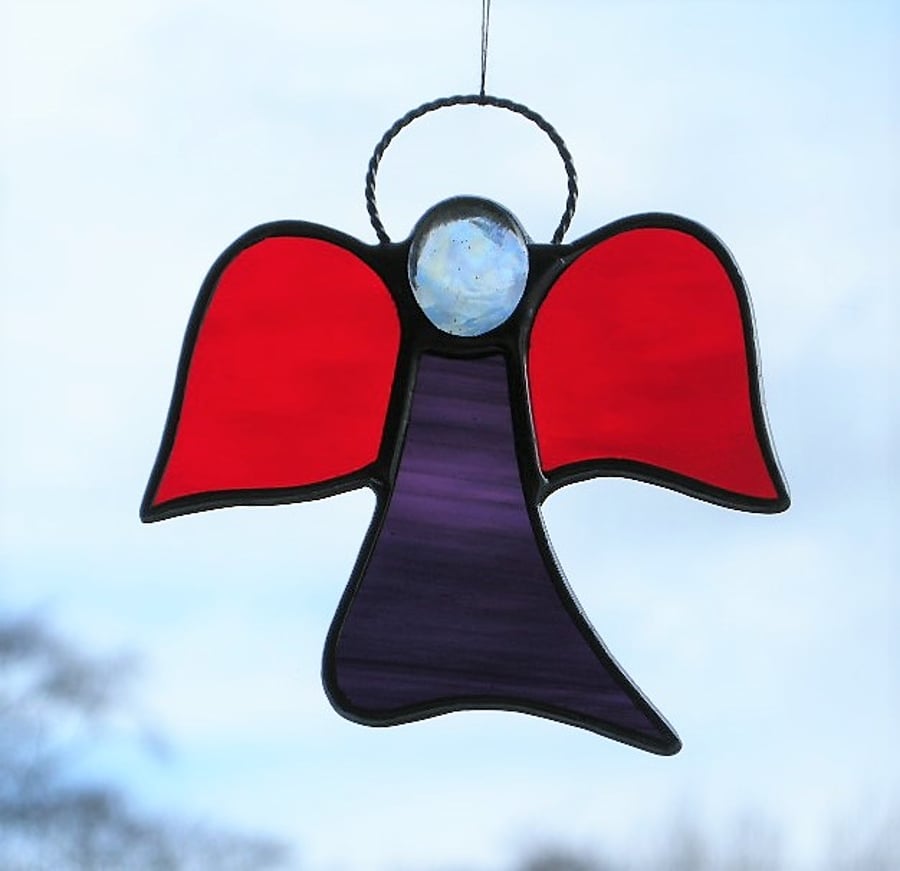 Stained glass (Angel) abstract in red and two purples waterglass