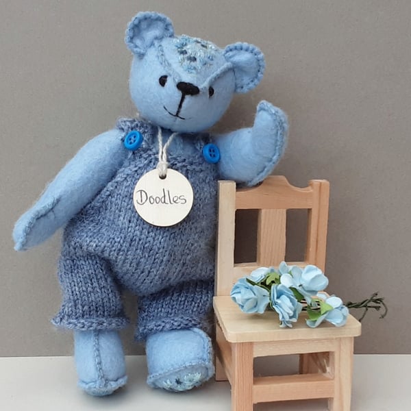 Dressed teddy bear in knitted dungarees, blue embroidered artist bear