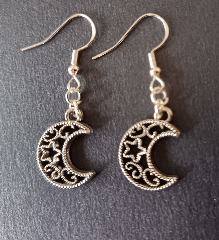 Silver moon and star detail dangle earrings 