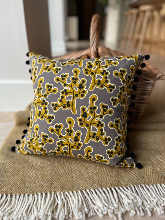 Botanical cotton cushion cover with pompoms