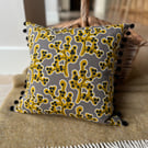Botanical cotton cushion cover with pompoms