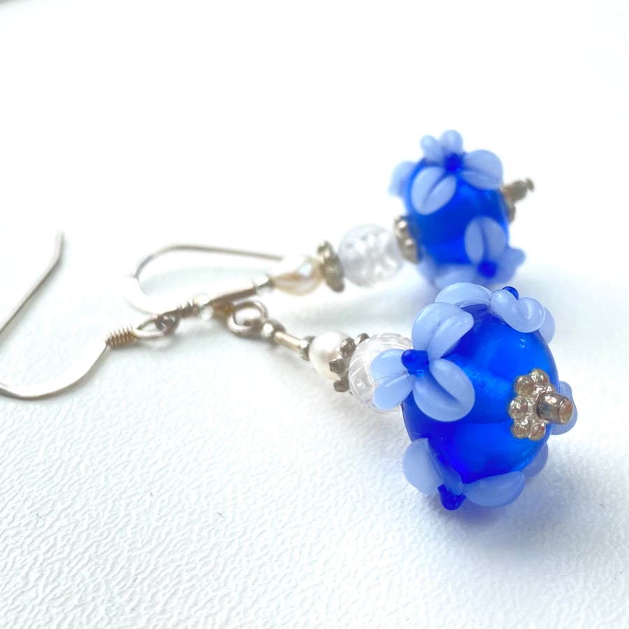 Blue glass Drop earrings - Pearl and flower Detail. 