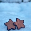 Leather star earrings in purple and pink metallic