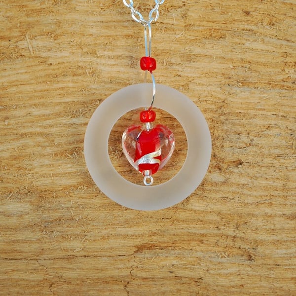 Glass ring pendant with red and silver heart