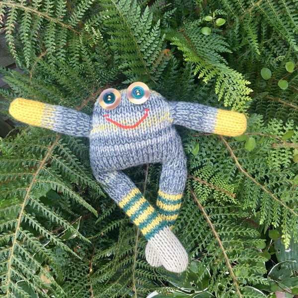Frog had knitted doll