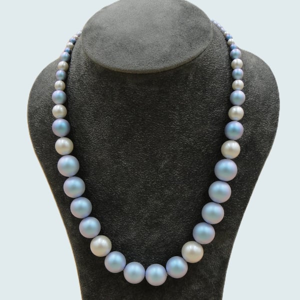 Beautiful iridescent  pale blue and cream pearl necklace. sterling silver clasp 