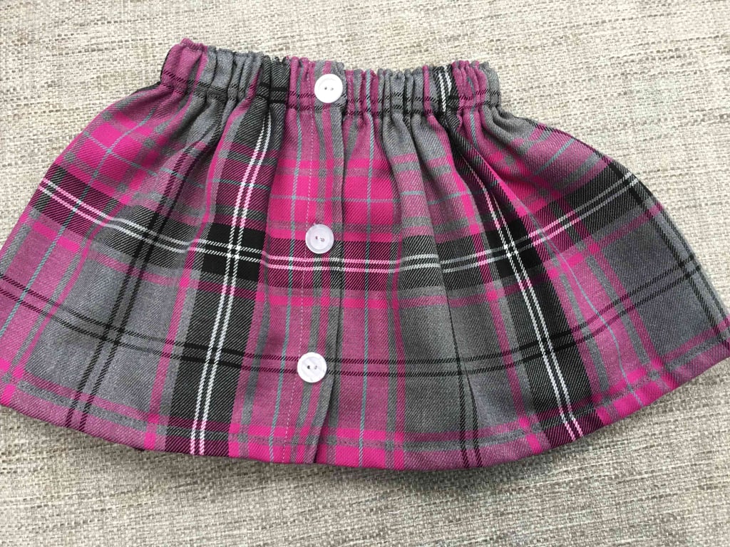 Toddler elastic  waist tartan skirt . 12-18 months 