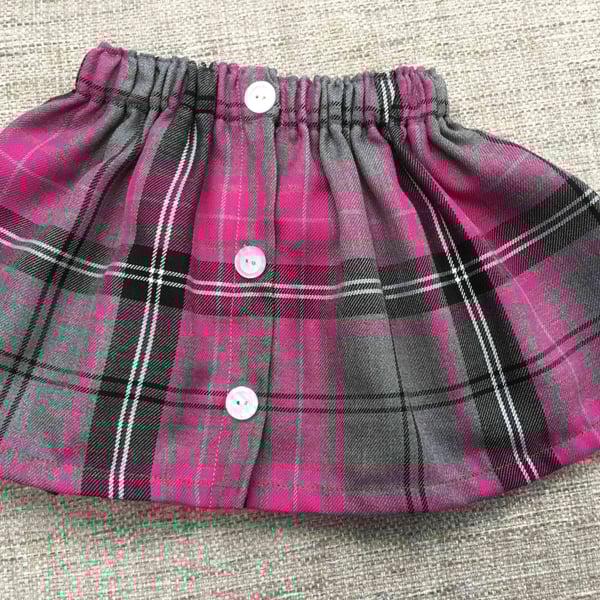 Toddler elastic  waist tartan skirt . 12-18 months 