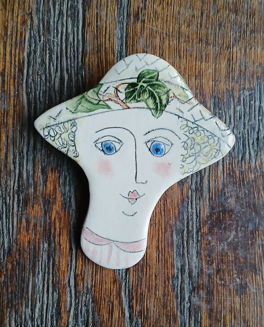Lady face brooches 