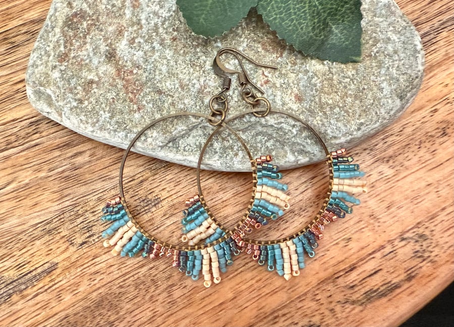 Medium bohemian beadwork hoop fringe earrings in blue and bronze