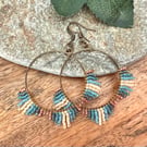 Medium bohemian beadwork hoop fringe earrings in blue and bronze