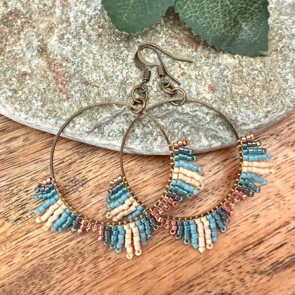 Medium bohemian beadwork hoop fringe earrings in blue and bronze