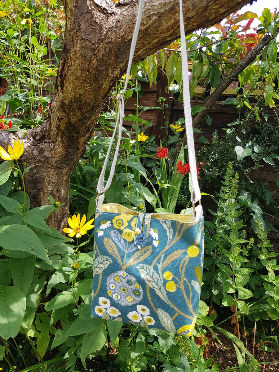 Fabric crossbody bag with adjustable strap: floral on teal