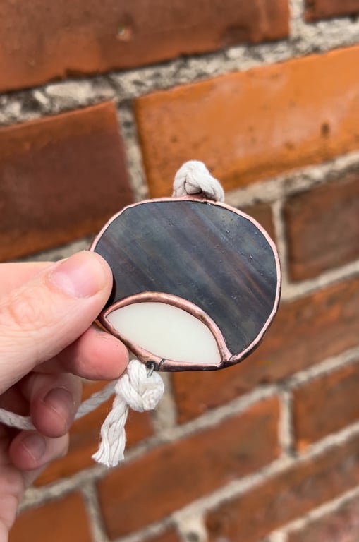Stained glass conker on a string - autumn horse chestnut seed