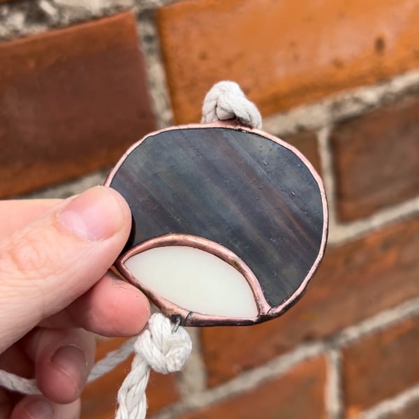 Stained glass conker on a string - autumn horse chestnut seed