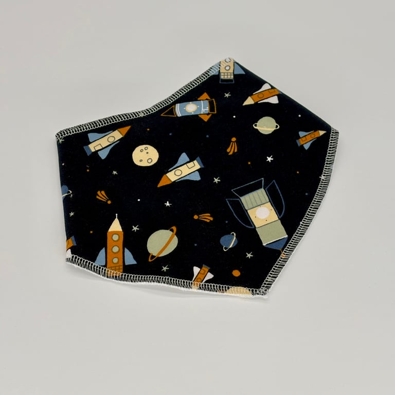 Handmade baby bandana bib in a rockets and space theme