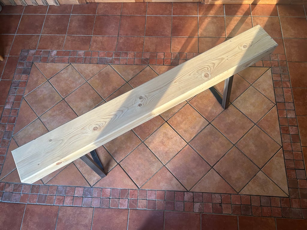Handmade bench with trapezium legs