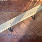 Handmade bench with trapezium legs