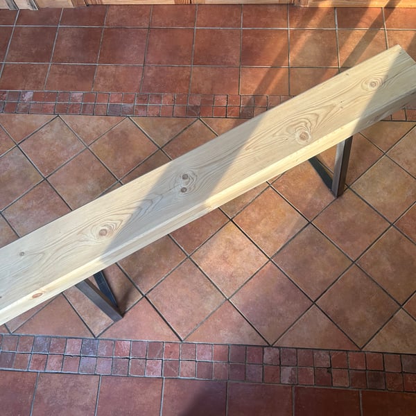 Handmade bench with trapezium legs