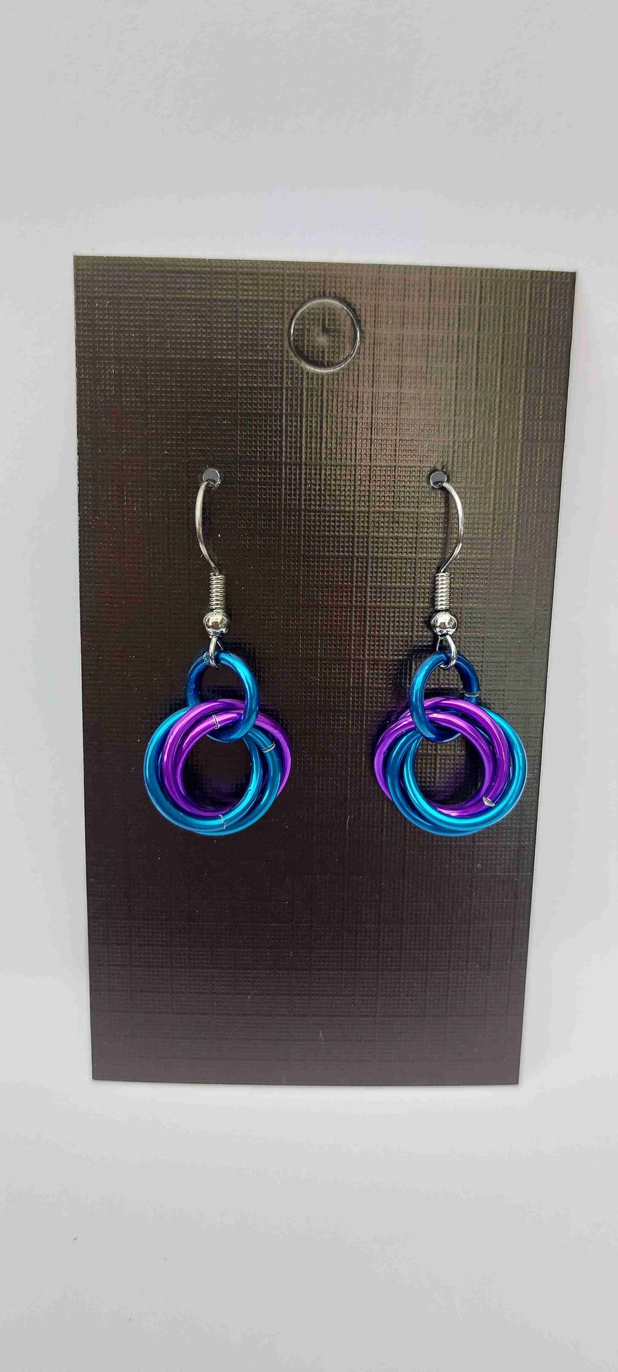 Earrings in blue and purple chainmail anodised aluminium on antiqued findings.