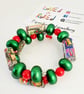 Vibrant memory wire bracelet made with Christmas paper  and preloved beads - Image 4