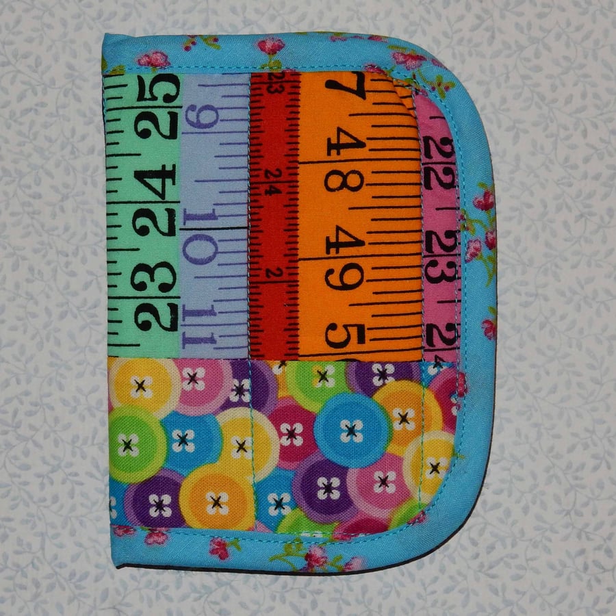 Needlecase - Bright tape measures and buttons