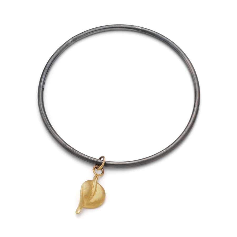 Luz by Fedha - oxidised sterling silver bangle with leaf pendant in vermeil   