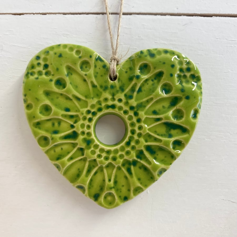Small Pottery heart decoration speckled green