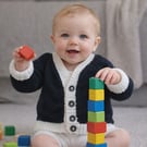 Lovely back cardigan with white edging. Add a lace ruffle for more fun.