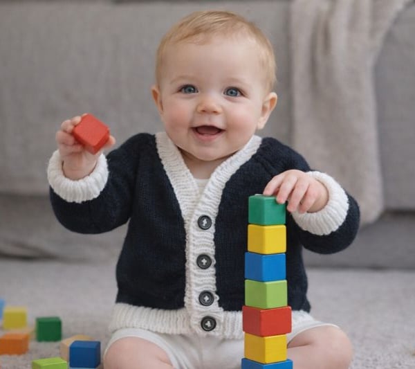 Lovely back cardigan with white edging. Add a lace ruffle for more fun.