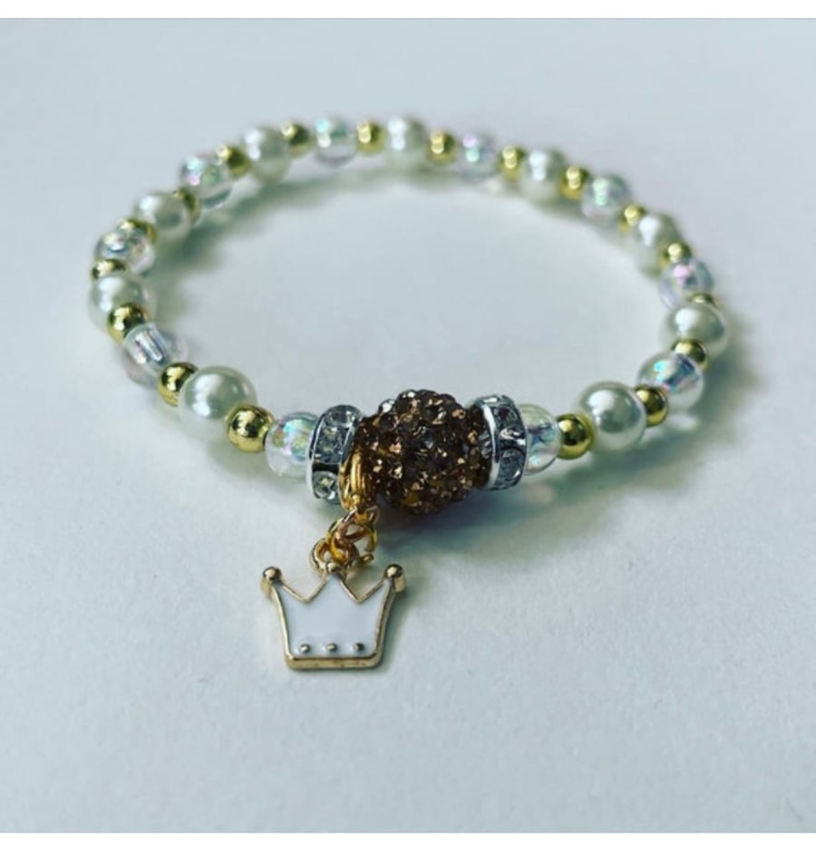 Crown charm pendant stretch beaded anklet ivory and goldtone 