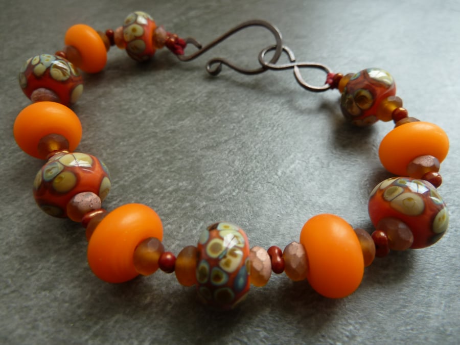 copper, orange lampwork glass bracelet
