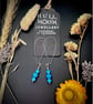 Sterling Silver and Turquoise Howlite Dangle Earrings - Image 1