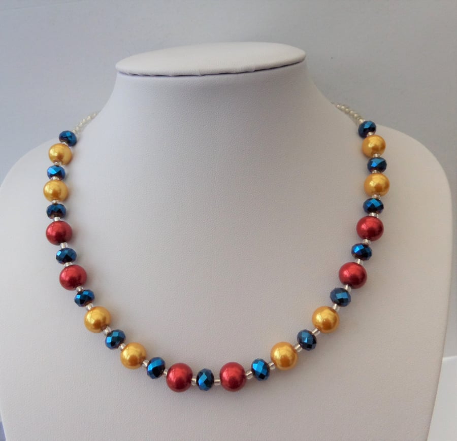 Bright coloured pearl and crystal necklace, red, gold, blue, silver.