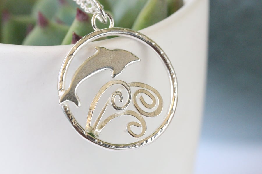 Dolphin jumping over waves silver necklace