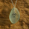 Beach glass pendant with sterling silver heart charm