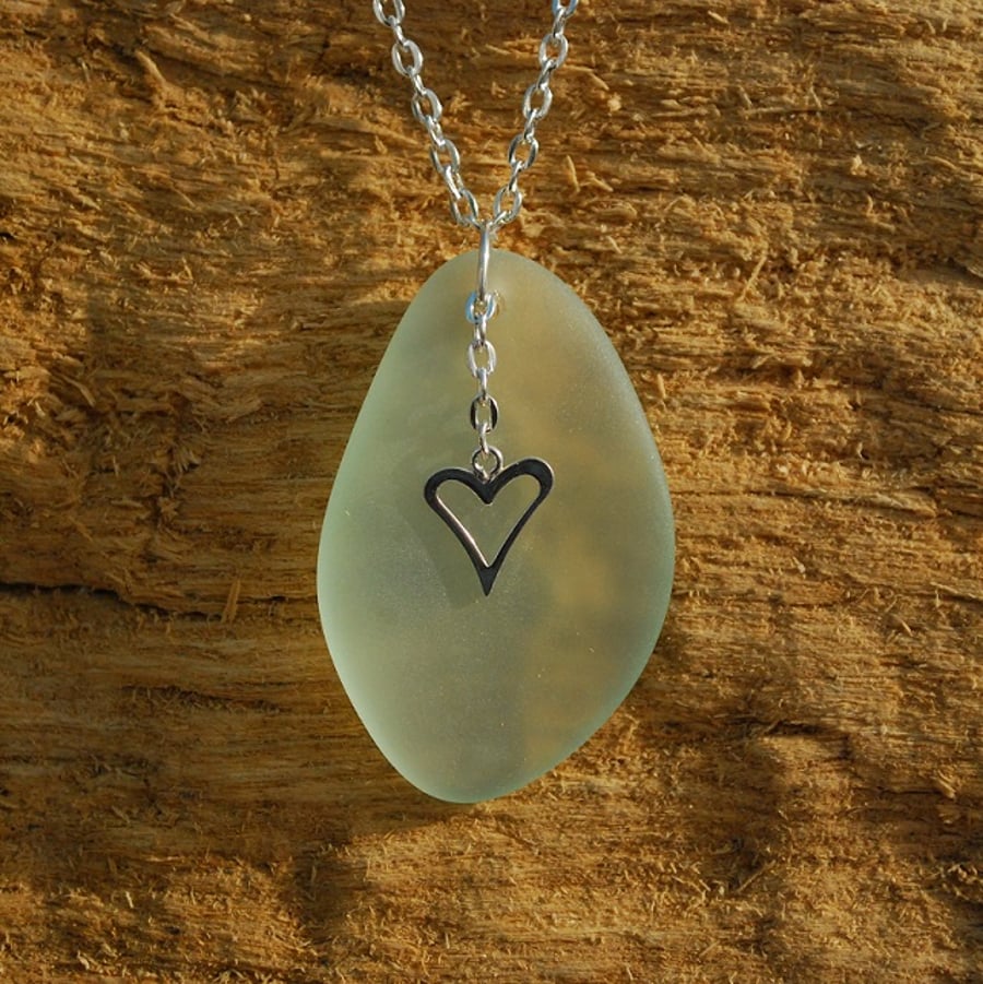 Beach glass pendant with sterling silver heart charm