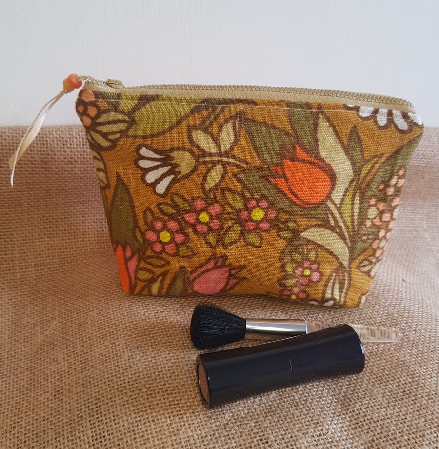 Vintage fabric  zipped pouch or makeup bag: orange tones