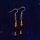 Silver earrings made with onyx and amber glass